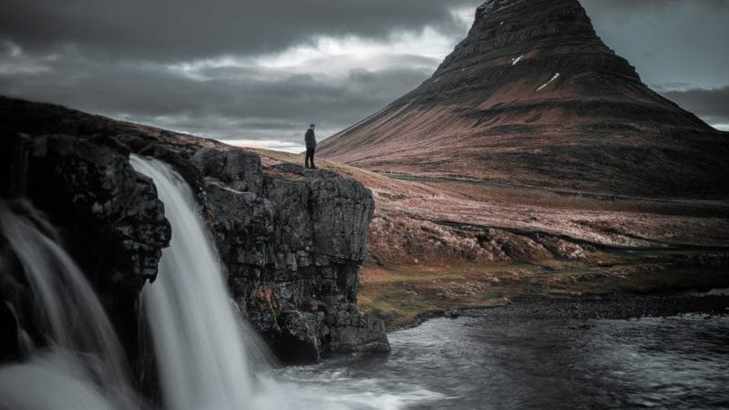 Kirkjufellsfoss waterfall and Kirkjufell mountain in the background