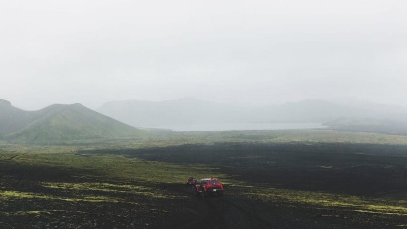 red super jeep driving in the highlands of Iceland on the way to Landmannalaugar