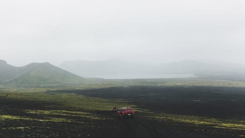 red super jeep driving in the highlands of Iceland on the way to Landmannalaugar