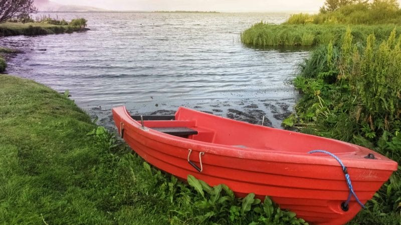 red boat in Lake Myvatn in North Iceland