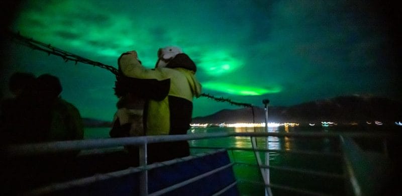 Northern Lights by boat, northern lights seen from sea in Reykjavik Iceland