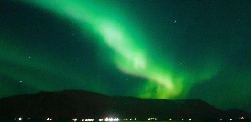 Northern Lights by boat, northern lights seen from sea in Reykjavik Iceland