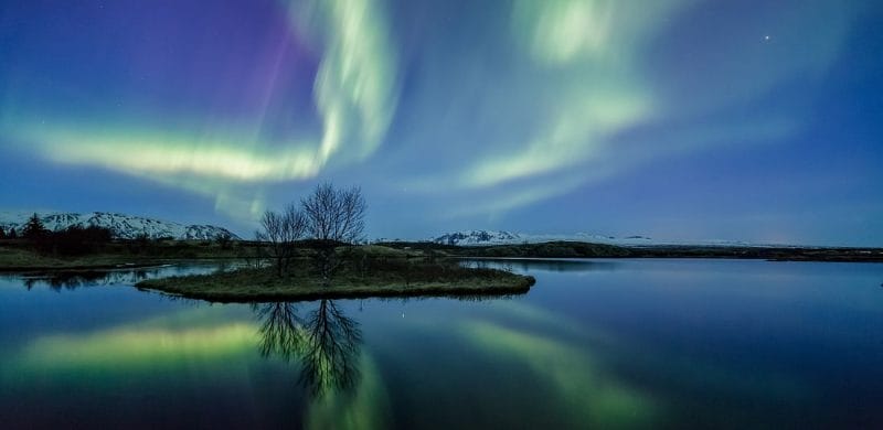 Northern Lights by boat, northern lights seen from sea in Reykjavik Iceland