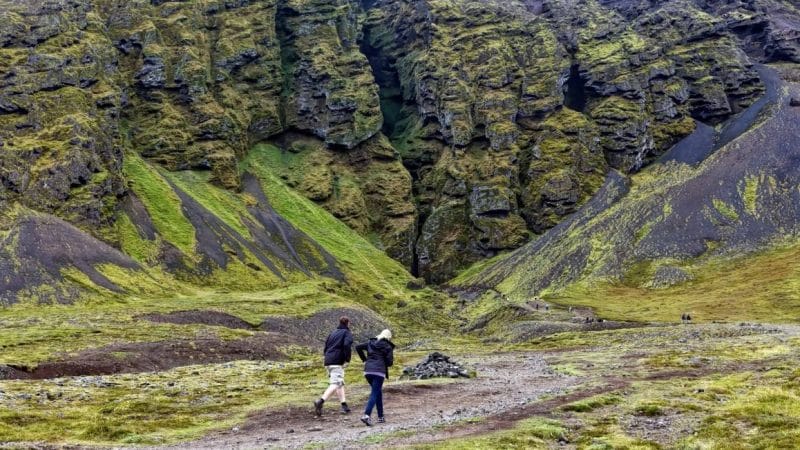 two man walking up to Rauðfeldsgjá Gorge in Snæfellsnes Peninsula