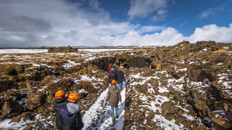 people on the way to Raufarhólshellir lava cave in Iceland