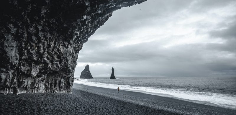 Black Sand Beach Tour, seen from the cave at Reynisfjara black sand beach, Hálsanefshellir cave on Reynisfjara black sand beach