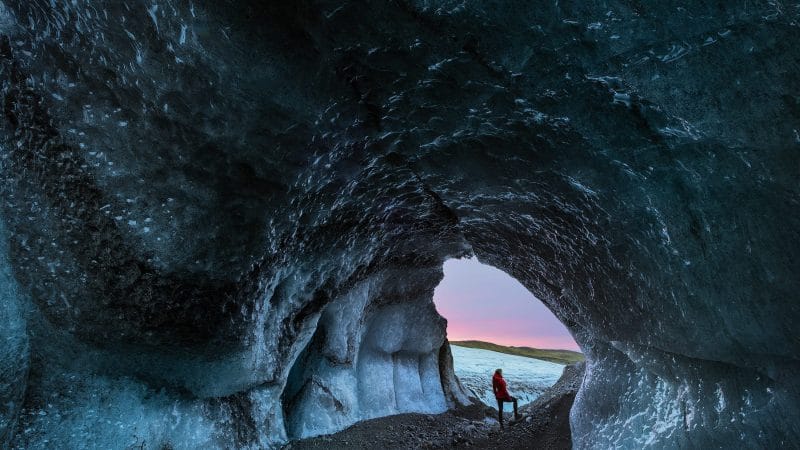 woman in an ice cave in Glacier Hiking in Skaftafell National Park