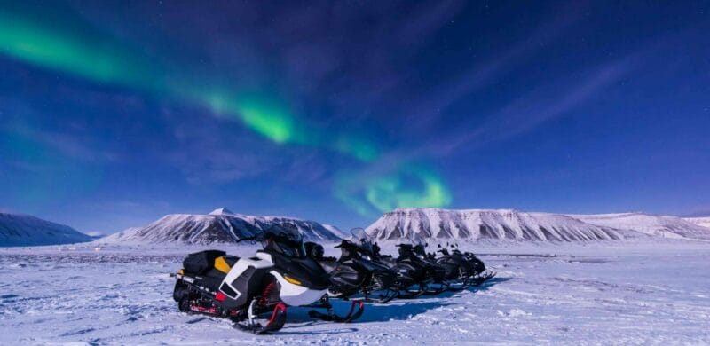 Iceland Snowmobile Tour, Snowmobile Iceland, Snowmobiling in Iceland, northern lights over snowmobiles in Iceland