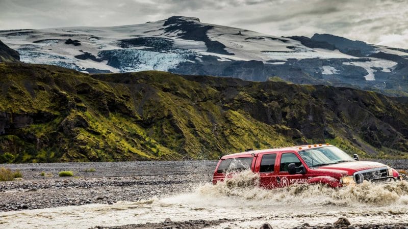 Super Jeep Tours Iceland, Super Jeep driving over a river on the way to Þórsmörk in the highlands of Iceland