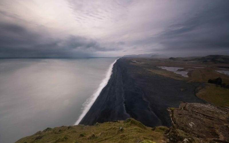 View over the black sand beach seen from Dyrhólaey cliffs in south Iceland