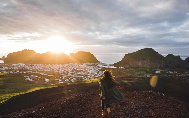 girl standing with a view over Vestmannaeyjar Westman Islands in south Iceland