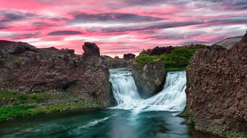 sunset at Hjálparfoss waterfall in the Golden Circle Highlands of Iceland