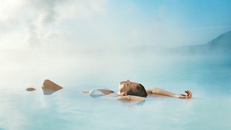 woman floating in the Blue Lagoon in Iceland