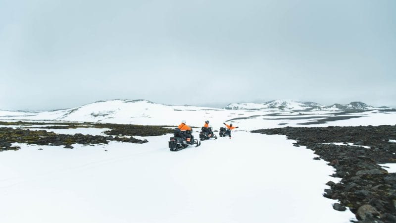 Iceland Snowmobile Tour, Snowmobile Iceland, Snowmobiling in Iceland, people on Eyjafjallajokull snowmobile tour with views of green moss