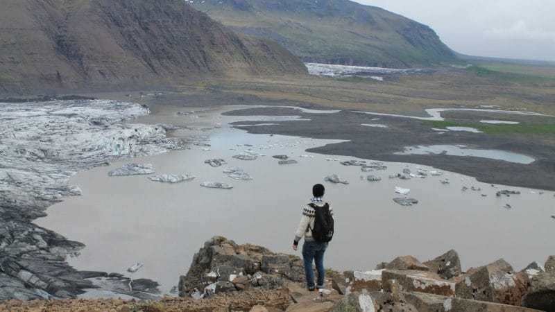 man standing looking at Sjónarnípa viewing point in Skaftafell Nature Reserve