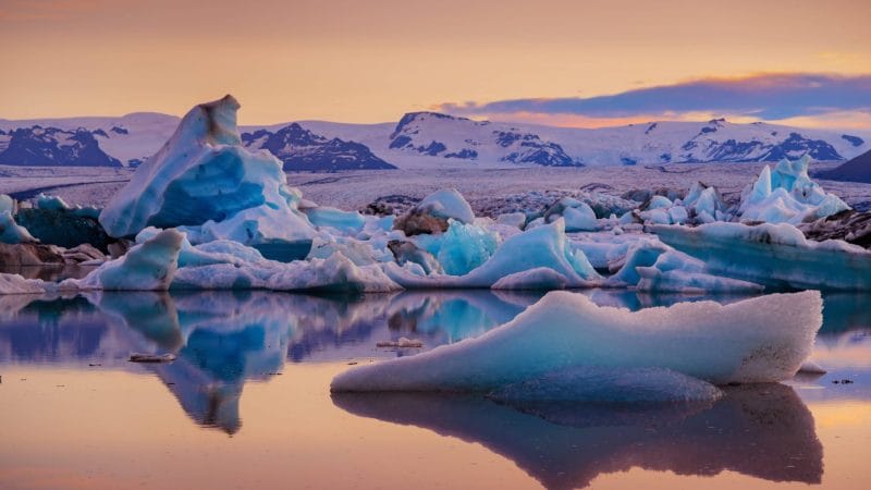 Midnight sun at Jokulsarlon glacier lagoon in south Iceland