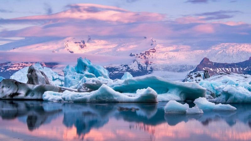 Midnight sun over Jokulsarlon iceberg available as Framed Prints