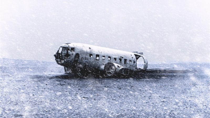 snow falling at Solheimasandur Plane Wreck in south Iceland