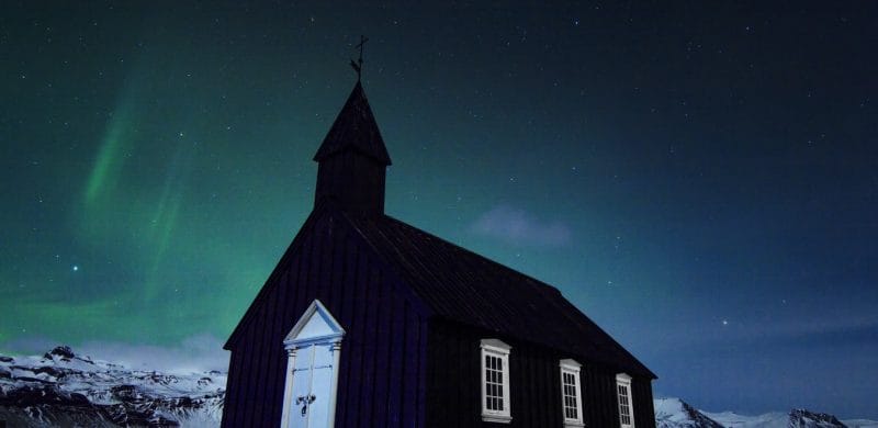 northern lights over Búðarkirkja black church in Búðir Snæfellsnes