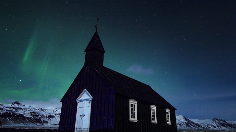 northern lights over Búðarkirkja black church in Búðir Snæfellsnes